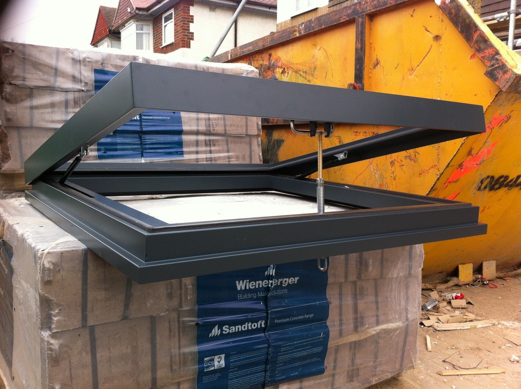 Opening flat roof skylight in anthracite grey installed in Morden
